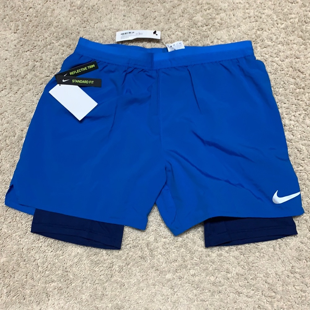 Blue Nike 2 in 1 reflective shorts. NWT Men’s L